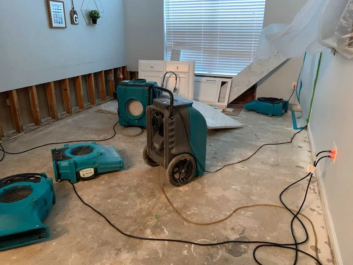 Dehumidifier in flood-cut room for Water Damage Restoration in Junction City